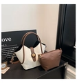 Close-up of contrast bucket bag with mini zipper pouch and vintage metal turn-lock - White