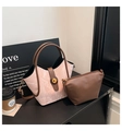 Detail of pink marble textured bucket bag with amber twist lock and inner pouch - Pink