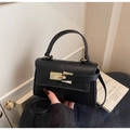 Minimalist black litchi grain shoulder bag with gold metal clasp and top handle - Black