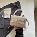 Elegant cream faux leather crossbody bag with litchi texture and gold metal buckle - Off White