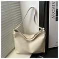 Close-up of cream white tote bag showing the soft faux leather texture and pleated details - Off-white without Pendant