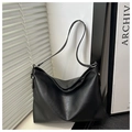 Detail of black pebbled leather hobo bag with silver hardware ring and adjustable strap - Black Without Pendant