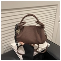 Detail of coffee brown suede handbag with thick rope knot handle and golden heart charm - Coffee (With Charm)