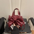 Deep red bow shoulder bag with star rivets and adjustable strap for women - Red