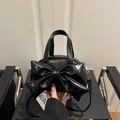 Chic black vintage crossbody bag with a large bow and star-shaped silver rivets - Black