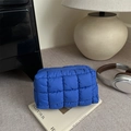 Royal blue quilted puffer makeup bag with puffy grid texture and zipper closure - Blue