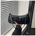 Detailed view of black underarm bag with double utility pockets and matte synthetic leather - Black