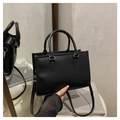 Classic black tote bag with vertical stripes textured finish and silver hardware - Black