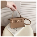 Brown lychee leather handbag with golden buckle and strap for elegant crossbody wear - Khaki
