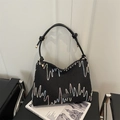 Grande borsa a spalla nera con ricami ondulati colorati e cinturini in pelle annodati di tendenza - Nero