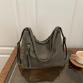 Dark green matte leather large hobo tote bag with zipper detail on a wooden table - Green Without Pendant