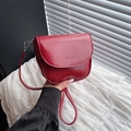 Chic red patent leather saddle bag with minimalist crossbody strap for women - Red
