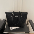 Minimalist black leopard print tote bag with premium gold metal hardware accents - Black