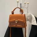 Caramel leather crossbody bag with golden ring lock and stylish knotted top handle - Brown