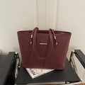 Deep wine red leopard print tote bag with gold metal accents and structured trapezoid shape - Red