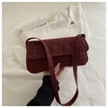 Detail of burgundy leopard texture suede shoulder bag with flap closure and slim strap - Red