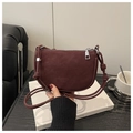 Matte burgundy crescent crossbody bag with adjustable knotted strap and metal charm - Red