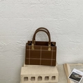 Brown faux leather crossbody bag with white stitching detail and gold hardware - Brown