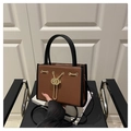 Caramel and black contrast tote bag with lychee texture and gold chain detail - Brown