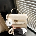 Creamy white leather crossbody bag with golden buckle and cute plush lamb charm - Beige With Charm