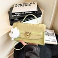 Light green faux leather crossbody bag with gold lock and plush keychain accessory - Green With Pendant