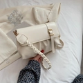 Chic beige pleated shoulder bag with woven strap and decorative gold buckle detail - Off White