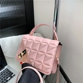 Pink quilted leather crossbody bag with gold chain strap and black clasp closure - Pink