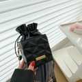Elegant black quilted drawstring bucket bag with gold chain strap for women - Black