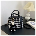 Detail of checkered tweed handbag with fuzzy monster charm and black leather strap - With Pendant / Black