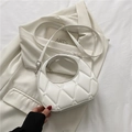 White quilted PU leather handbag with circular handle and detachable shoulder strap - White