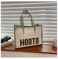 Minimalist cream canvas tote bag with olive green trim and HOOTO letter print - Green