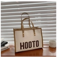 Cream canvas tote bag with brown leather trim and HOOTO lettering detail - Khaki