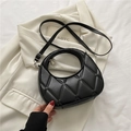Black half-moon bag with geometric quilted texture and adjustable shoulder strap - Black