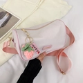 Cylindrical cream shoulder bag with pink strap and strawberry charm detail - With Pendant / Pink