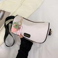 Beige cylindrical crossbody bag with wide strap and a cute strawberry pendant - With Pendant / Black