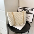 Chic cream white quilted tote bag with gold chain strap for versatile shoulder wear - White