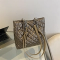 Quilted metallic bronze tote bag with chain straps for stylish high-capacity commuting - Gold