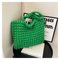 Detailed close-up of emerald green popcorn fabric texture on a large tote bag - Green