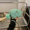 Quilted mint green oval crossbody bag with gold flower detail and a plush pom-pom charm - Green / Small