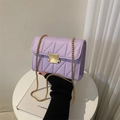 Chic lavender quilted shoulder bag with gold chain strap and metallic rivet closure - Purple