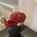 Red quilted oval chain bag with gold flower ornament and plush pompom charm - Red / Small