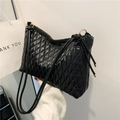 Chic black quilted bucket bag with diamond stitching and elegant golden hardware - Black