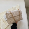 Chic cream white quilted chain bag with triangular stitching and gold metal strap - White
