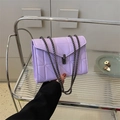 Lavender quilted chain shoulder bag with a metal twist lock and minimalist design - Purple