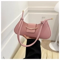 Detailed view of pale pink minimalist handbag featuring a golden crescent metal lock buckle - Pink