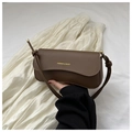 Close-up of brown faux leather bag with gold Fashion & Bags logo and slim shoulder strap - Brown