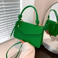 Chic green mini crossbody bag with embossed woven texture and knotted handle detail - Green