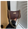 Detail of dark brown croc-embossed underarm bag with chunky gold chain strap and metal trim - Brown