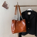 Brown vintage PU leather tote bag with chain shoulder strap and fashion label detail - Brown