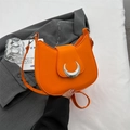 Bright orange crescent moon shoulder bag with silver hardware and adjustable strap - Orange